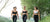 Three athletic women walking in a park.