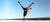 Athletic Person doing a handstand with one arm