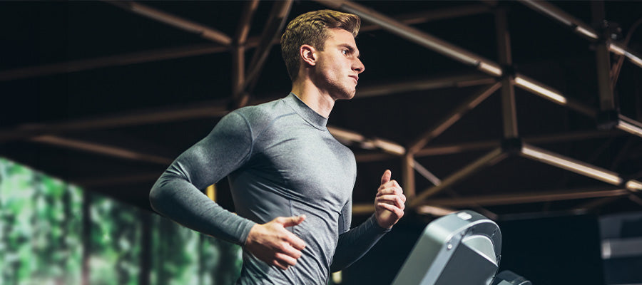 Athletic male running on a treadmill