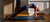 woman doing yoga stretches on a yoga mat