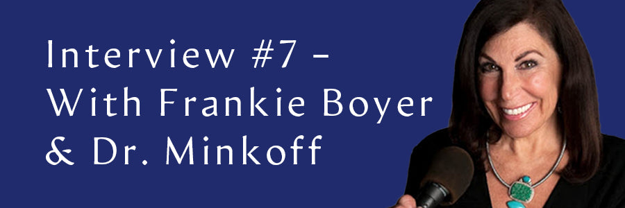 Frankie Boyer smiling with a dark blue background.