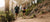 Athletic Man and Woman running on a dirt path in a park.