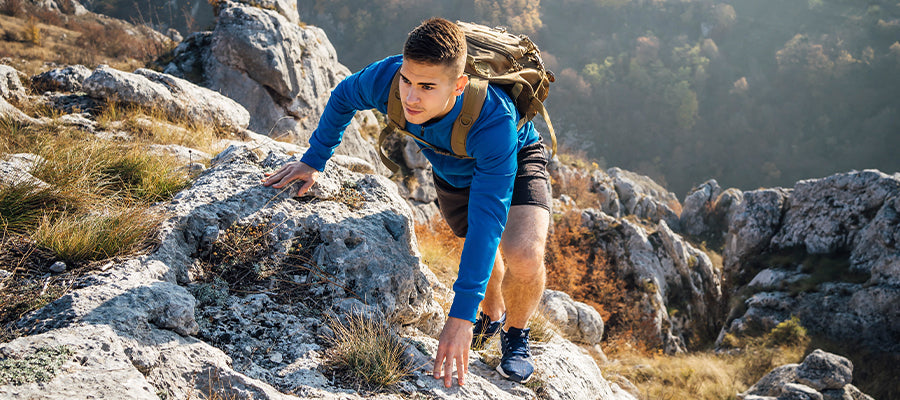 Athletic Man hiking in the hills
