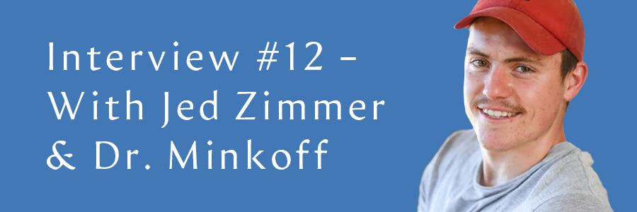 Jed Zimmer smiling on a light blue background.