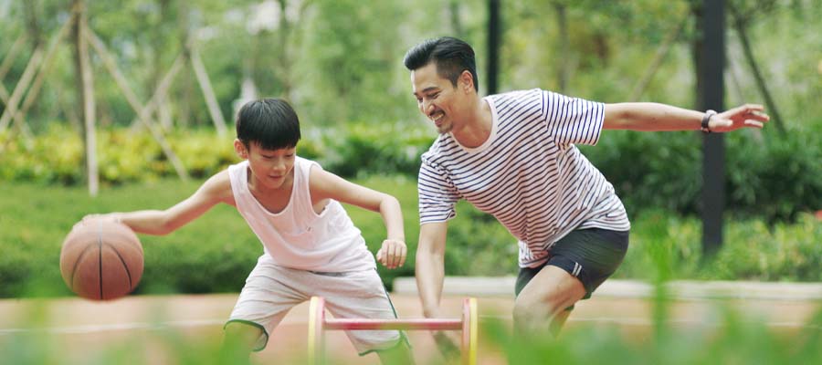 Father and son playing basketball | BodyHealth.com | Protein specific problems specific to children | Dr. David Minkoff